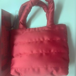 Estée Lauder red cosmetics bag